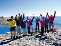 The group celebrate an ascent in the Remarkables |  <i>Chris Buykx</i>