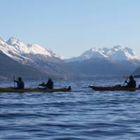 Kayaking on Lake Wakatipu beneath snow capped mountains | Rippled Earth